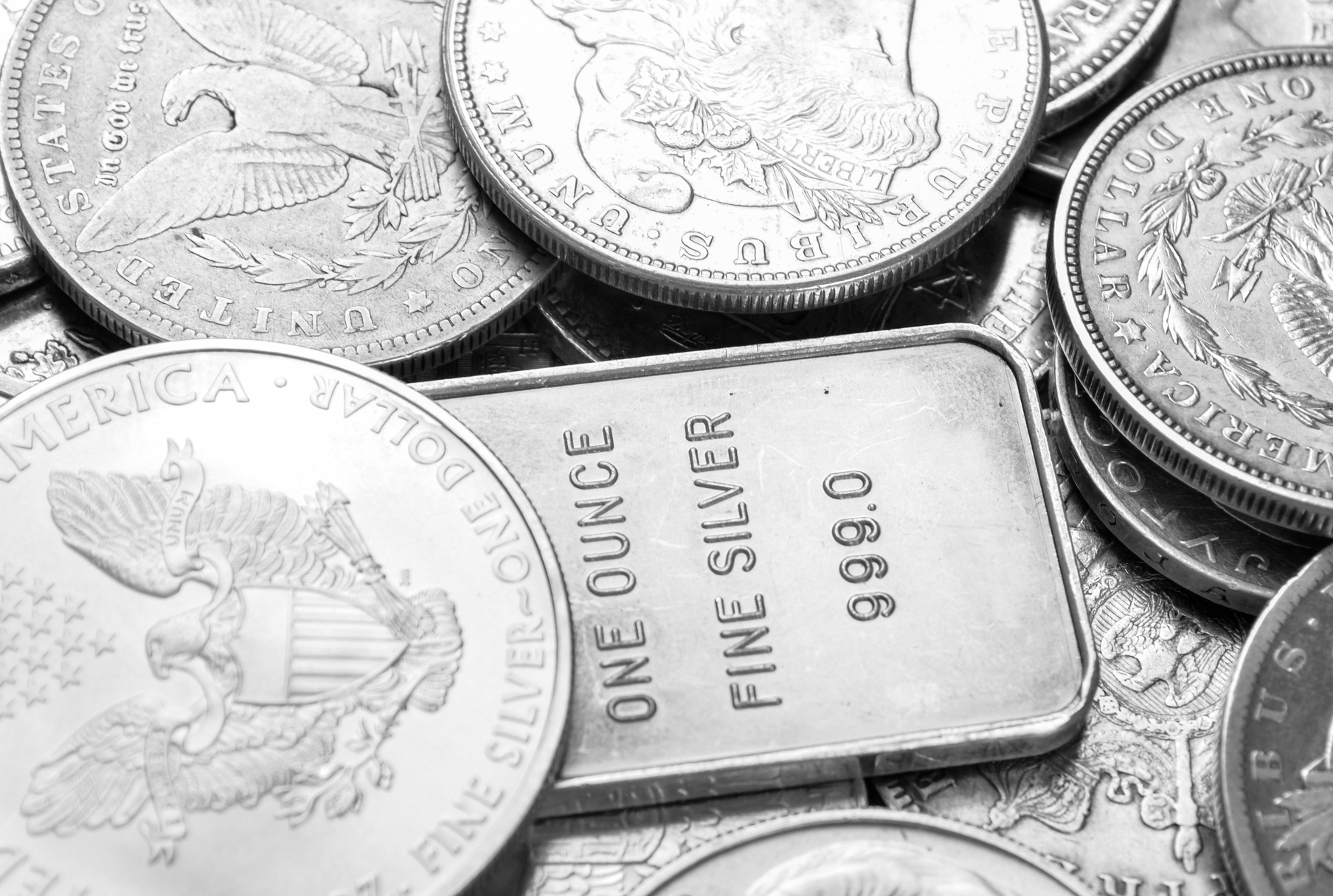 Silver coins and bars macro shot